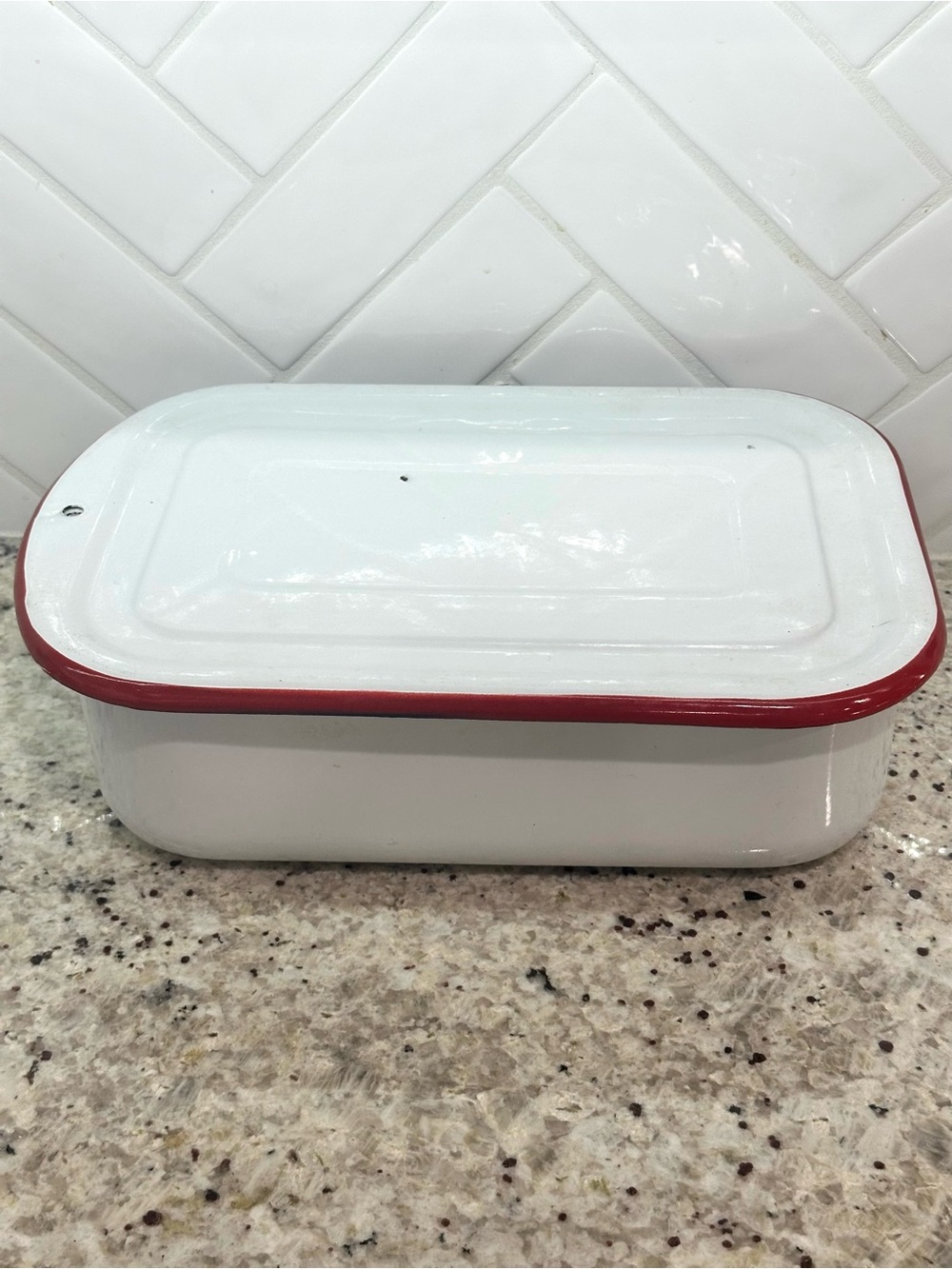 Vintage white enamel pan with red trim
